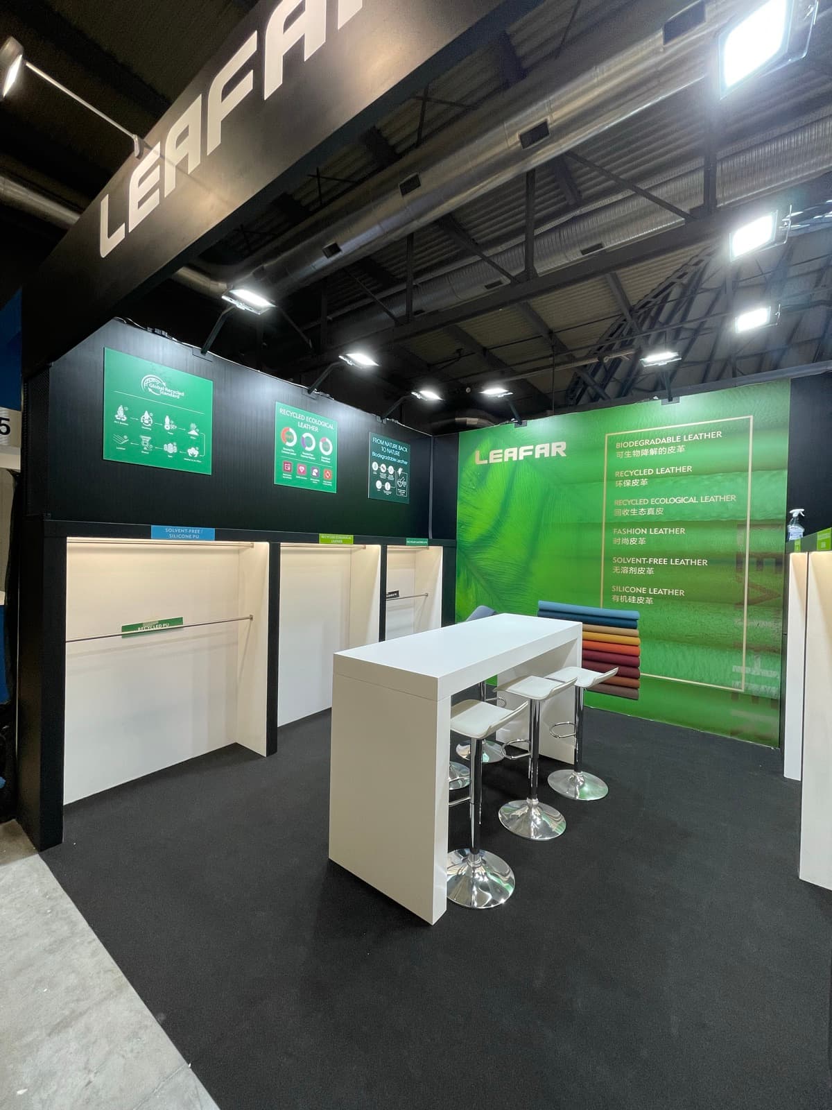 Leafar stand with green graphic wall